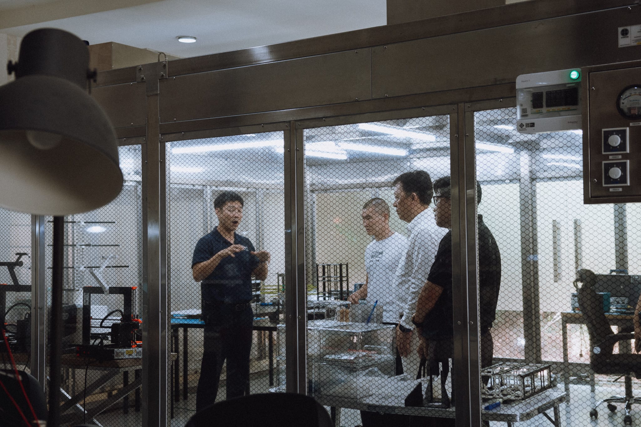 Engineers in the EOS Orbit clean room during a build review